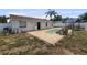 Backyard showcasing the pool with a waterfall feature, gazebo, and white privacy fence at 1009 Sagamore Dr, Seffner, FL 33584