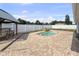 Backyard featuring a kidney bean shaped pool with waterfall and a shaded patio area at 1009 Sagamore Dr, Seffner, FL 33584