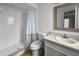 Bright bathroom featuring a walk in shower, commode and a vanity with a sink at 1009 Sagamore Dr, Seffner, FL 33584