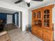 Dining room with a wooden hutch, tile floors, and an open floor plan at 1009 Sagamore Dr, Seffner, FL 33584