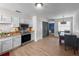 Kitchen featuring stainless steel appliances, white cabinets, and hardwood floors at 1009 Sagamore Dr, Seffner, FL 33584