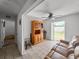 Relaxing living room with a wooden hutch, tiled floors, and a sliding door out to the pool at 1009 Sagamore Dr, Seffner, FL 33584