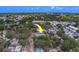An aerial neighborhood shot of the house highlights the abundance of mature trees at 102 7Th Se Ave, Largo, FL 33771