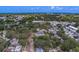 An aerial view of the neighborhood featuring tree lined streets, mature trees, and homes at 102 7Th Se Ave, Largo, FL 33771