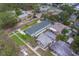 Aerial view shows fresh landscaping and a brick road highlighting the neighborhood's beauty at 102 7Th Se Ave, Largo, FL 33771