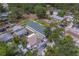 Aerial shot showcasing property's location in a quiet neighborhood, surrounded by mature trees and well-kept homes at 102 7Th Se Ave, Largo, FL 33771
