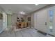 Dining room with seating for six flows from entryway, next to front door at 102 7Th Se Ave, Largo, FL 33771