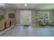 Inviting foyer featuring stylish tile floors and light neutral walls, creating a seamless flow to other living areas at 102 7Th Se Ave, Largo, FL 33771