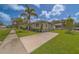 Beautiful single-story home with well-manicured lawn and mature trees in a desirable neighborhood at 102 7Th Se Ave, Largo, FL 33771