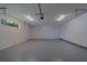 Spacious garage with clean gray floor, bright lighting, and an overhead door system at 102 7Th Se Ave, Largo, FL 33771