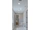 Hallway features wood-look floors, modern lighting, and a utility sink with laundry hook-ups at 102 7Th Se Ave, Largo, FL 33771