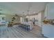 Open concept kitchen with large island and barstool seating flowing into the living area at 102 7Th Se Ave, Largo, FL 33771