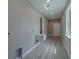Bright laundry room features wood-look floors and a utility sink at 102 7Th Se Ave, Largo, FL 33771