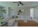 Living room showcasing large sectional couch and decorative coffee table with doors on either side of the room at 102 7Th Se Ave, Largo, FL 33771