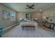 Relaxing main bedroom with an accent chair by the windows, offering comfort and style at 102 7Th Se Ave, Largo, FL 33771