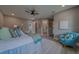 Spacious main bedroom with a cozy chair and en-suite bathroom, offering style and comfort at 102 7Th Se Ave, Largo, FL 33771
