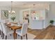 Inviting dining area adjacent to a modern kitchen with stainless steel appliances and quartz countertops at 10414 Hallmark Blvd, Riverview, FL 33578