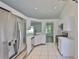 Bright kitchen with stainless steel appliances, white cabinets, and white countertops at 10414 Hallmark Blvd, Riverview, FL 33578