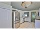 Bright kitchen with stainless steel appliances, white cabinets, and white countertops at 10414 Hallmark Blvd, Riverview, FL 33578