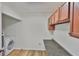 Functional laundry area features a modern washer, ample shelving, and counter space for folding at 10414 Hallmark Blvd, Riverview, FL 33578