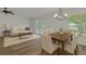 Bright living and dining area with neutral décor, hardwood floors, and ample natural light at 10414 Hallmark Blvd, Riverview, FL 33578