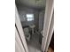 Bathroom featuring tiled walls, pedestal sink, toilet, and updated shower at 1107 Grant St, Clearwater, FL 33755