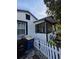 Home exterior featuring black trimmed and white picket fence at 1107 Grant St, Clearwater, FL 33755