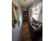 Hallway featuring hardwood floors and built in cabinets at 1107 Grant St, Clearwater, FL 33755