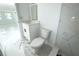 Bathroom featuring a vanity, toilet and tile shower at 1109 N Obrien St, Tampa, FL 33607
