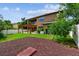 Expansive backyard featuring a pergola covered patio and manicured lawn at 11407 Drifting Leaf Dr, Riverview, FL 33579
