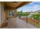 Balcony has views of a lush green backyard and a pergola at 11407 Drifting Leaf Dr, Riverview, FL 33579