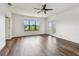Bright and spacious bedroom with a ceiling fan, large windows and balcony access at 11407 Drifting Leaf Dr, Riverview, FL 33579