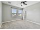 Spacious bedroom with neutral paint, carpet flooring and plenty of natural light at 11407 Drifting Leaf Dr, Riverview, FL 33579