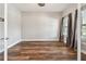 Empty bedroom with hardwood floors, neutral walls, and bright windows at 11407 Drifting Leaf Dr, Riverview, FL 33579