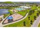 Aerial view of lake, community pool, playground and recreation areas at 11407 Drifting Leaf Dr, Riverview, FL 33579