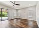 Bright living room with hardwood floors and large sliding door to the outside at 11407 Drifting Leaf Dr, Riverview, FL 33579