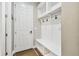 Mudroom with built-in bench, hooks, and shelving, perfect for keeping organized at 11407 Drifting Leaf Dr, Riverview, FL 33579