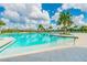 Community pool with lounge seating and a zero entry access point at 11407 Drifting Leaf Dr, Riverview, FL 33579