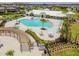 Community pool with large tanning deck, pergola, BBQ, lounge seating, and clubhouse at 11407 Drifting Leaf Dr, Riverview, FL 33579