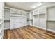 Large walk-in closet with custom shelving and ample storage space at 11407 Drifting Leaf Dr, Riverview, FL 33579