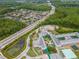 Overhead view of school campus and the surrounding community and natural landscape at 11623 Greensleeve Ave, Tampa, FL 33626
