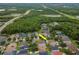 Aerial view of a residential neighborhood showcasing well-maintained homes, lush landscaping, and mature trees at 11623 Greensleeve Ave, Tampa, FL 33626