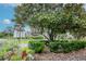 Beautiful community entrance featuring lush landscaping, a prominent sign, and an inviting atmosphere at 11623 Greensleeve Ave, Tampa, FL 33626