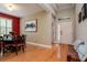 Elegant dining room featuring a round table, hardwood floors, and a seamless transition to the entryway at 11623 Greensleeve Ave, Tampa, FL 33626