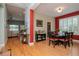 Open-concept layout showcasing the dining room, hardwood floors, and seamless flow into the living spaces at 11623 Greensleeve Ave, Tampa, FL 33626