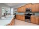 Well-lit kitchen with stainless steel appliances, island sink, and ample cabinet space at 11623 Greensleeve Ave, Tampa, FL 33626