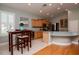 Open-concept kitchen with breakfast bar and adjacent dining area filled with light at 11623 Greensleeve Ave, Tampa, FL 33626