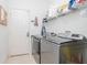 Modern laundry room with updated machines and ample storage space at 11623 Greensleeve Ave, Tampa, FL 33626