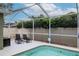 Inviting pool area featuring a screened enclosure and lounging space at 11623 Greensleeve Ave, Tampa, FL 33626