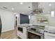 Well-equipped kitchen featuring stainless steel appliances, granite countertops, and ample cabinet space at 1311 W Perdiz St, Tampa, FL 33612